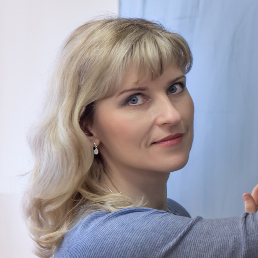 Geometry teacher standing at the blackboard and drawing something
